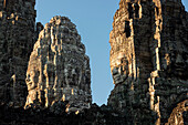  Panoramic image of giant stone-carved faces of Bodhisattva Lokeshvara, also known as Avalokiteshvara, Bayon Temple, Angkor Thom, UNESCO World Heritage Site, Angkor Wat, Siem Reap, Cambodia, Asia 