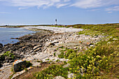 Bay and lighthouse of Goulenez in background,Ile de Sein,off the coast of Pointe du Raz,Finistere department,Brittany region,west of France,western Europe