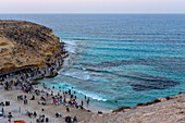 Summer beachgoers enjoy the famous Agiba 'miracle' beach cove near Marsa Matrouh on the Egyptian North Coast