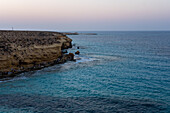Summer beachgoers enjoy the famous Agiba 'miracle' beach cove near Marsa Matrouh on the Egyptian North Coast