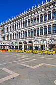  Colorful covers and seating in front of cafes on St. Mark&#39;s Square, Venice, Italy 
