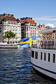  Sweden, Stockholm, Strandvägen, shore with boat and Swedish flag 