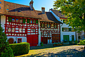 City Square with House and Tree in a Medieval Old Town in a Sunny Summer Day with Blue Sky in Regensberg, Zurich Canton, Switzerland.