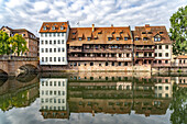  Houses of the old town reflected in the Pegnitz river, Nuremberg, Bavaria, Germany  