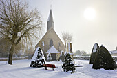 church of the village of Saint-Lucien covered with snow in the mist, department of Eure-et-Loir, Centre-Val-de-Loire region, France, Europe