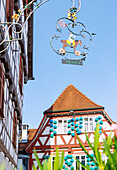  Half-timbered houses with signs and facade decorations on the market square in the old town of Kirchheim unter Teck, Baden-Württemberg, Germany 