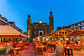  Restaurant and the historic town hall on the market square in Venlo at dusk, Netherlands  