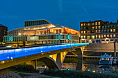  Primark on Maasboulevard and illuminated bridge over the city harbor in Venlo at dusk, Netherlands  