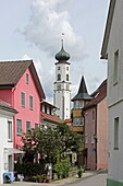  View along the street Am Stadtbach towards the tower of the hall building in Isny im Allgäu, Baden-Württemberg, Germany 