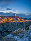  View across the gorge to the old town of Matera at night, Matera, Basilicata, Southern Italy, Italy, Southern Europe, Europe 
