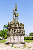  Parish enclosure with Calvary with rich figural decoration in Plougonven, Cote du Leon, Finistere, Brittany, France 