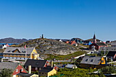  Colorful wooden houses and church, as well as a statue of Hans Egede on a hill, Nuuk, Sermersooq, Greenland, Europe 