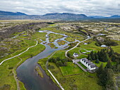  Aerial view of the Rift Valley and the church with buildings in Thingvellir National Park along the Golden Circle tourist route, near Selfoss, South Region, Iceland, Europe 