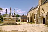  Calvaire (Calvary) and Chapelle Notre-Dame de Tronoen in Saint-Jean-Trolimon, Cornouaille, Finistere, Brittany, France 