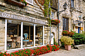  Gourmandises et Traditions confectionery shop with white nougat and antique shop at Place du Puits in Rochefort-en-Terre, Morbihan, Brittany, France 