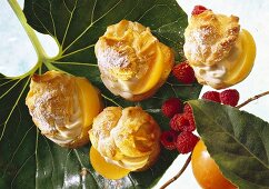 Filled cream puffs with apricot cream