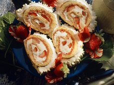 Four slices of sponge roulade with mascarpone & strawberries