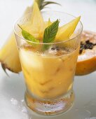 Papaya & pineapple drink, with carambola stars & mint