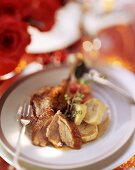 Duck with baked apple and dumpling slices