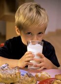 Small boy with a glass of milk