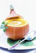 Pumpkin soup with crème fraiche in hollowed-out pumpkin