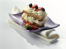 Puff pastry slice with maracuya mousse and berries