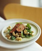 Lamb fillet on white bean and spinach salad