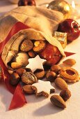 Biscuits, nuts and apple in Santa's sack