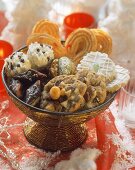 Various Christmas biscuits in decorative bowl