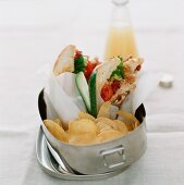 Club sandwich and crisps in a lunch box