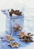 Gingerbread stars in front of and in a metal box