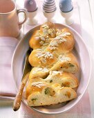 Bread plait with marzipan and apricots, a piece cut