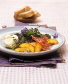 Wild herb salad with peaches, goat's cheese & basil oil