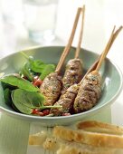 Middle Eastern mince kebabs with spinach salad