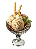 Walnut ice cream with cream and wafer rolls in sundae glass