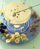Sweet quark and cream fondue with fruit and muesli balls