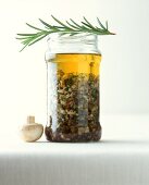 Spicy mushrooms with rosemary in jar
