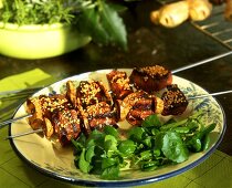 Duck kebab with sesame and pieces of ginger root