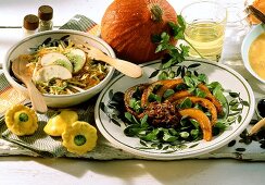 Raw pumpkin and apple salad and fried pumpkin with olive paste