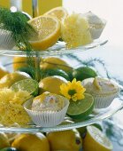 Tiered stand with lemon buns, lemons and limes