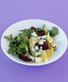 Avocado salad with grapefruit and beetroot on violet