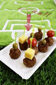 Meatball kebabs in front of a football bath towel