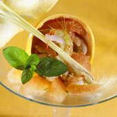 Shrimps with grapefruit segments in a grapefruit half