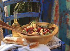 Potato salad with herbs and tomatoes, bread and herb oil