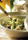 Cucumber Salad in a Serving Bowl; Spoon
