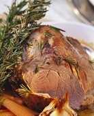 Braised veal with sprigs of rosemary and carrots 