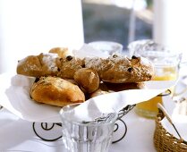 Olive breads and rolls on wire basket with napkin