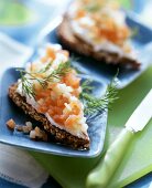 Wholemeal bread with salmon and apple tartar and fresh dill