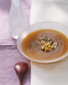 Papaya and melon soup with beef fillet and black sesame