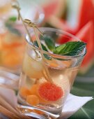 Melon drink with fresh mint in glass